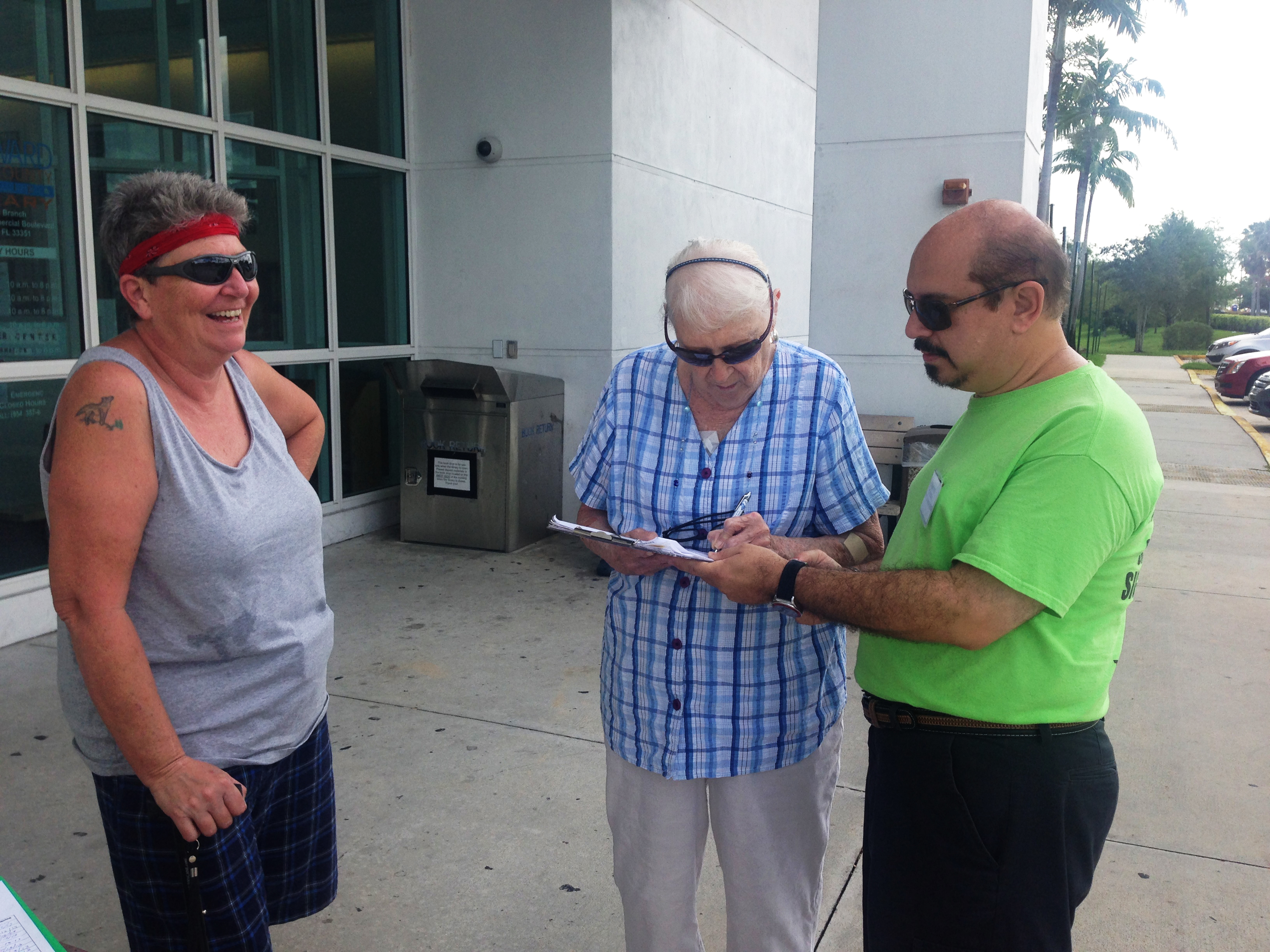 Residents signing the petition at the Tamarac Public Library. 