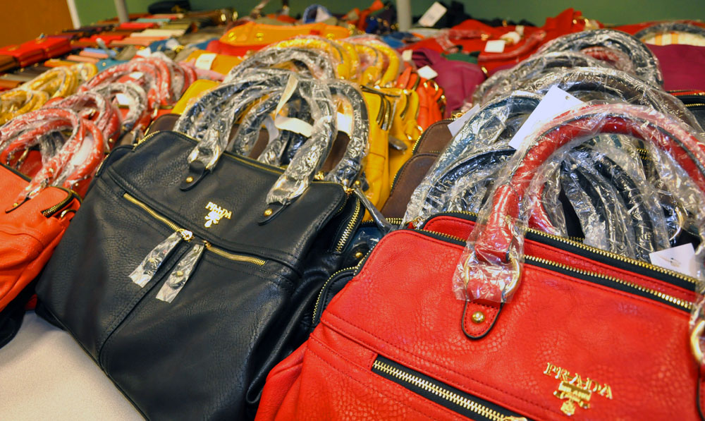 Tamarac Woman Arrested: Hundreds of Counterfeit Purses Confiscated