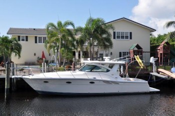Hage and Pozzuoli's yacht in back of Hage's Coral Ridge Country Club home in Fort Lauderdale.