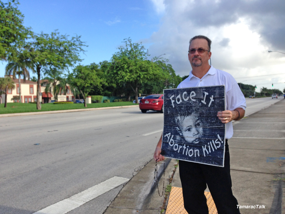 Abortion Protesters Warn Drivers About Local Clinic in Tamarac
