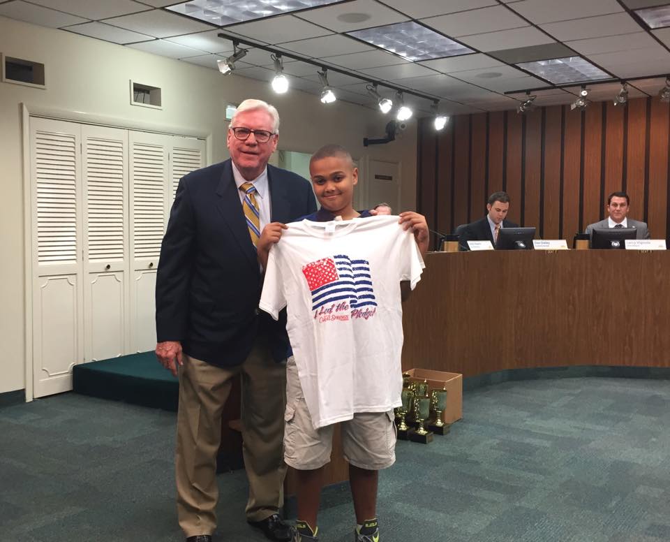 How does Coral Springs get those children to come to meetings?  Simple: they get to say the pledge, be on TV, receive a nifty t-shirt and get a photo op with the mayor.  