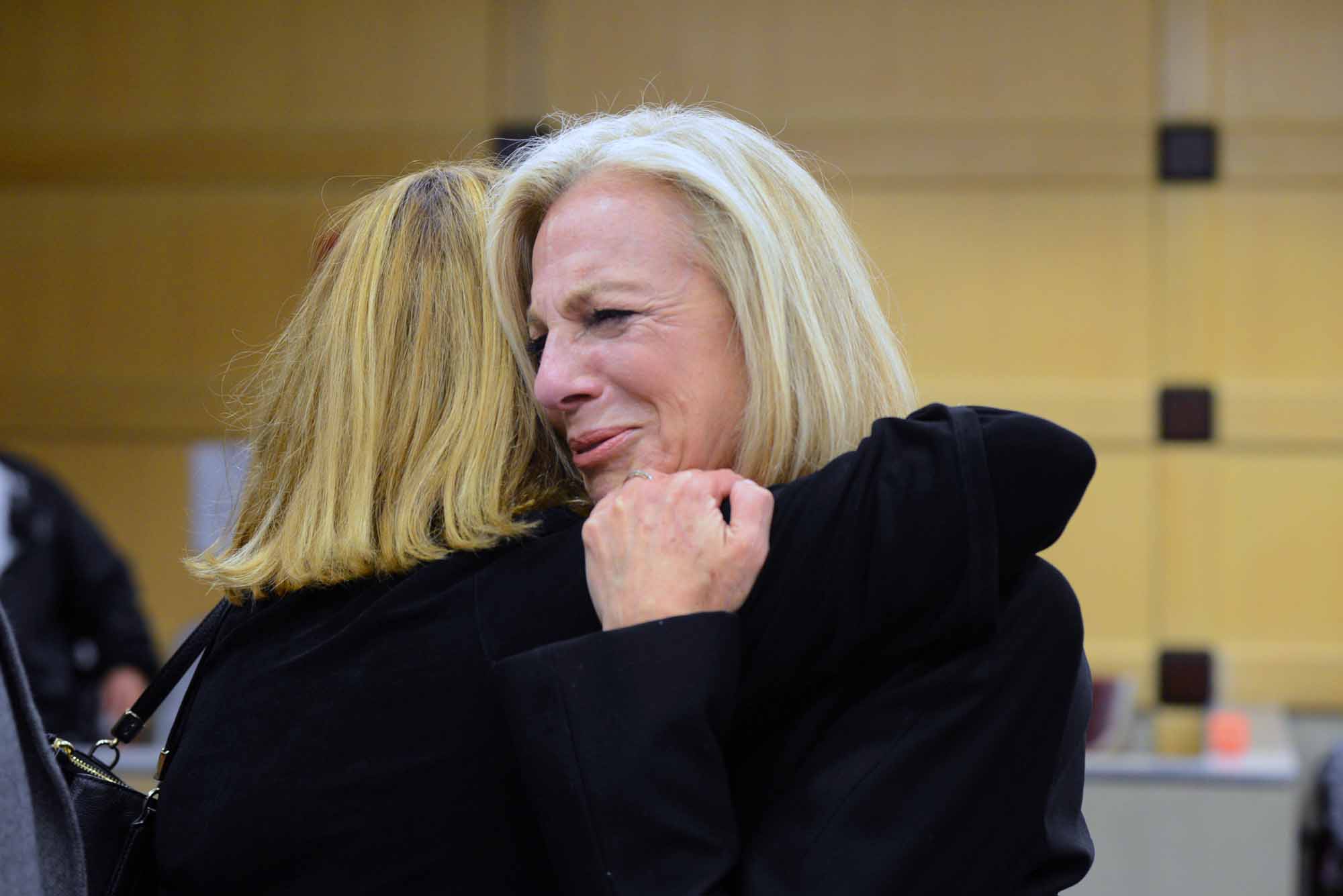 Friend Michele Mellgren hugs Beth Talabisco after the trial.