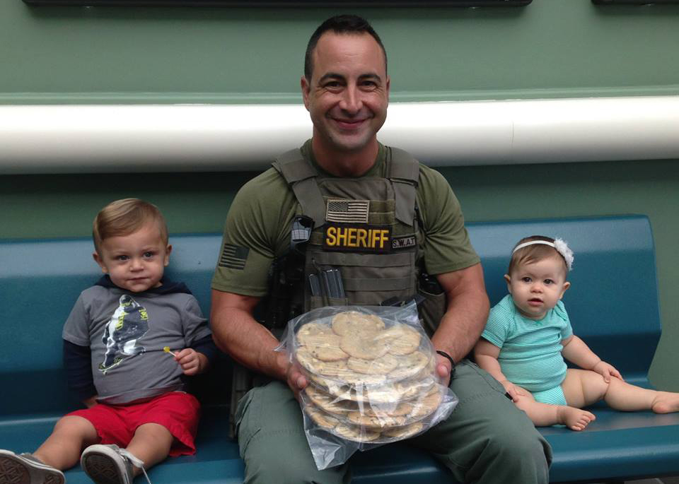 BSO Deputy Vincent Ciacciarelli with "Cookies for a Cop" volunteers Gunner and Emery. - Photo Courtesy BSO