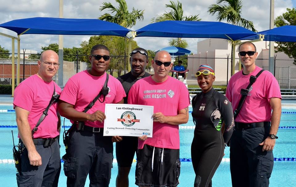 BSO Fire Chief Ken Kronheim and members of Fire Rescue Station 37 joined with community members at the Lauderdale Lakes Swimming Complex. Together, they were ?Uniting Broward? by raising funds for Breast Cancer Awareness. Photo Courtesy BSO.