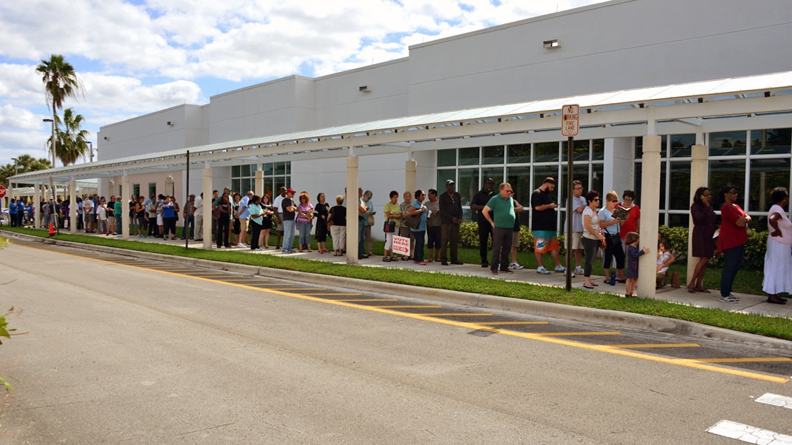 Voters didn't seem to mind waiting in the long lines for early voting at the Tamarac Branch Library on Monday.