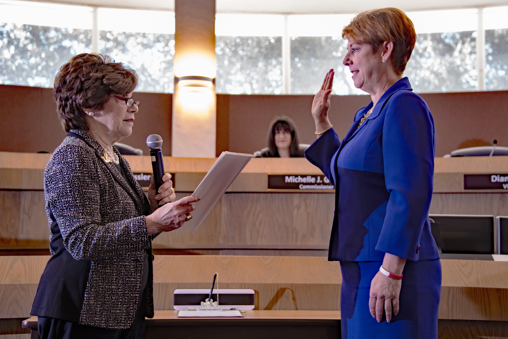 Newly elected Broward County Commissioner Nan Rich swearing in Julie Fishman.